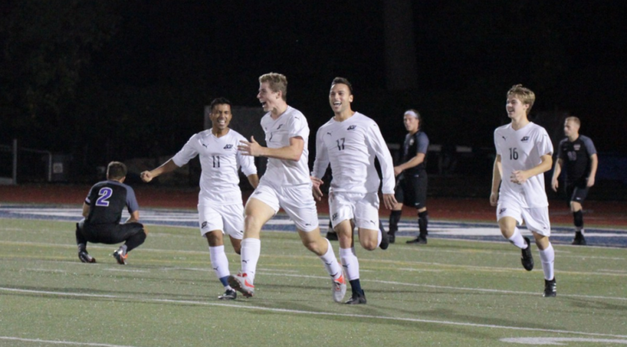 Blue Streaks freshman Mikey Burrington (7) celebrates after scoring a game winning goal in double overtime against Mount Union on Oct. 6 at Don Shula. 