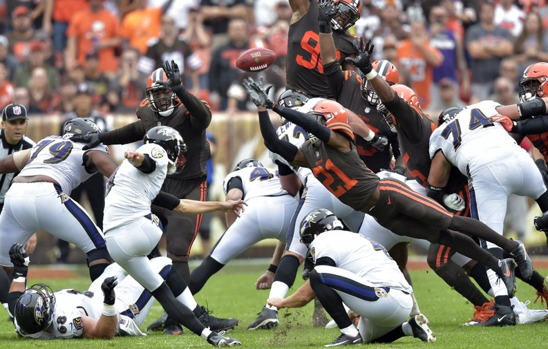 “Cleveland Browns DB Denzel Ward (21) blocks a field goal-attempt by the Baltimore Ravens during the first half of an NFL football game, Sunday Oct. 7, 2018 in Cleveland
