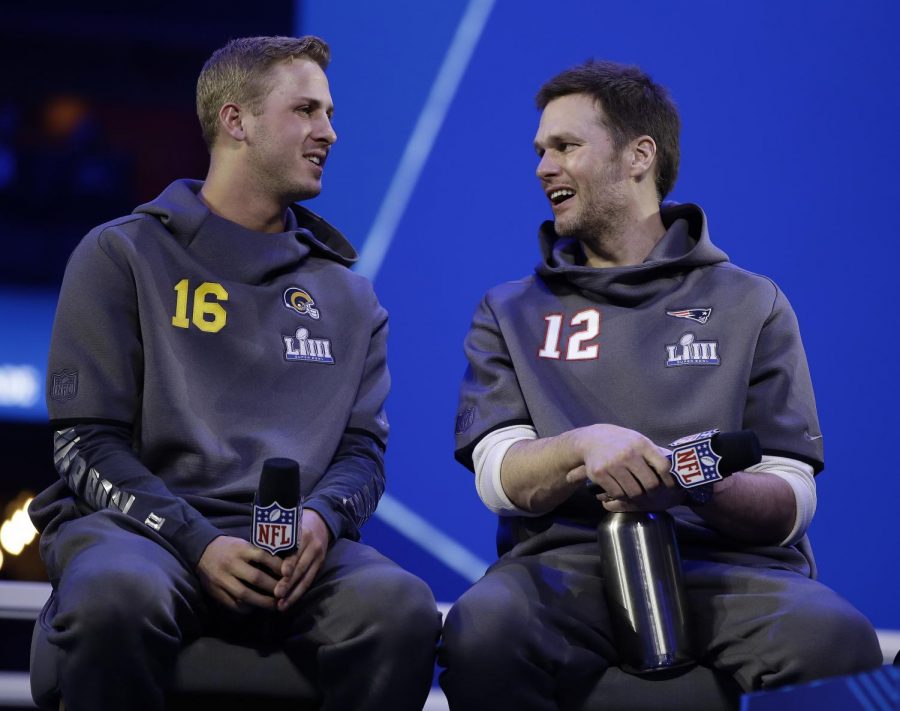 Los Angeles Rams QB Jared Goff (right) and New England Patriots QB Tom Brady (right) speak with each other at Super Bowl Media Day on Monday, Jan. 28, 2019. (Associated Press)