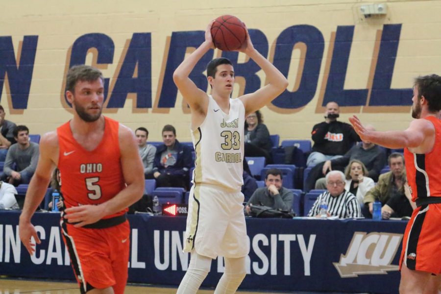 Freshman Emmett Chambers (33) looks to make a pass in a game against Ohio Northern on Feb. 9 at JCU.