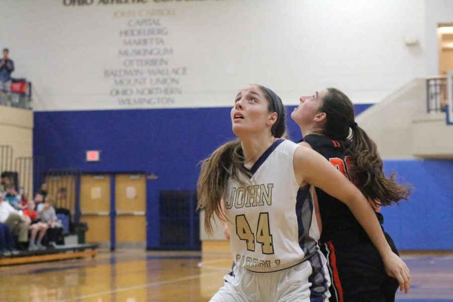 Olivia Nagy boxes out it an attempt to get a rebound.