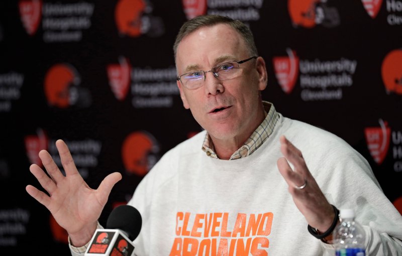 In this April 19, 2018, file photo, Cleveland Browns general manager John Dorsey answers questions about the draft during a news conference at the NFL football team's training camp facility, in Berea, Ohio. Dorsey, was previously in Kansas City before taking over in Cleveland late last year. (AP Photo/Tony Dejak)