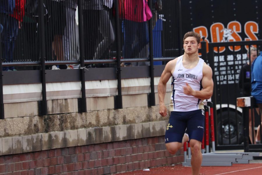 Sophomore sprinter Bobby Fogle races around the track at Otterbein University in the OAC Championships held in Westerville, Ohio.
