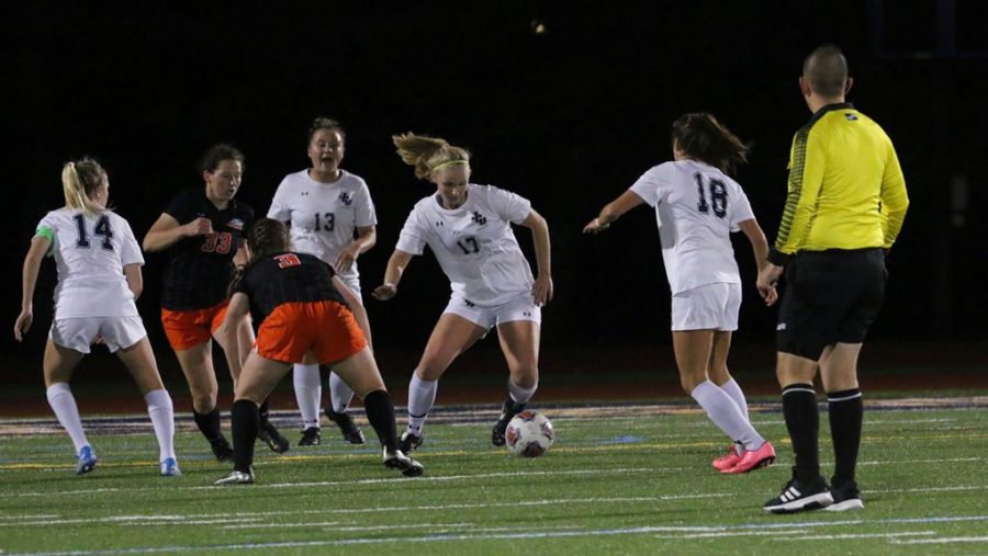 Freshman Claire Hollern (Middle, No. 17) dribbles around defenders in a game at Don Shula Stadium on Oct. 19, against Ohio Northern.