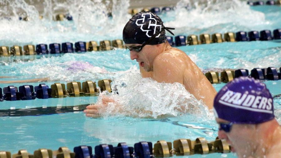 Senior Mason Beck competes in an OAC match in the Johnson Natatorium on Nov. 11. 