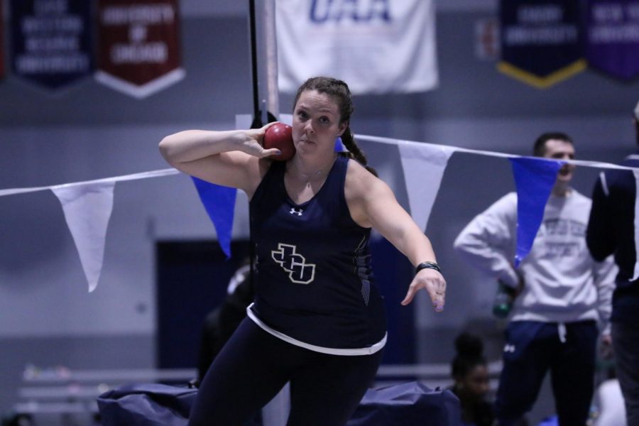 Sophomore Olivia Hurtt holds the shot put in a competition at Case Western on Saturday, Dec. 7.