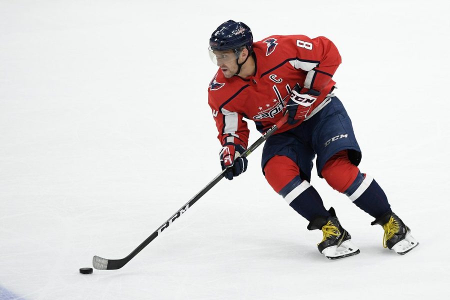 Washington Capitals left wing Alex Ovechkin (8), of Russia, skates with the puck during the third period of an NHL hockey game against the Montreal Canadiens, Thursday, Feb. 20, 2020, in Washington. The Canadiens won 4-3 in overtime. (AP Photo/Nick Wass)