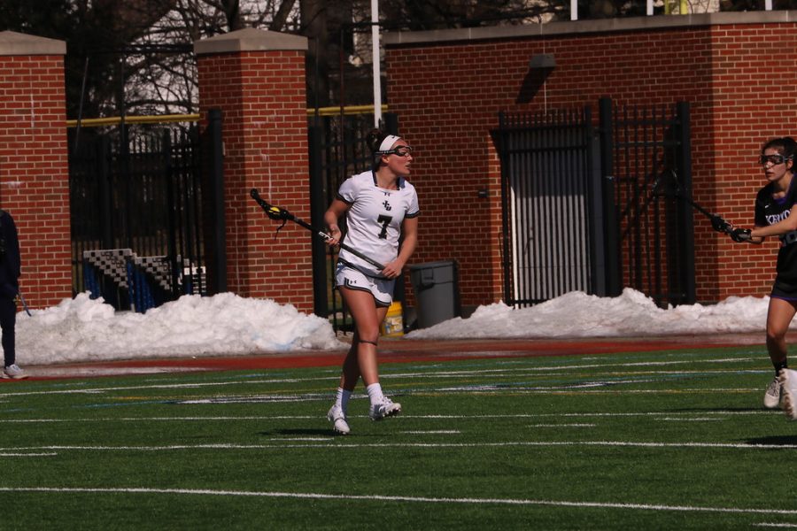 Colleen Grombala carries the ball in a game against Capital on Feb. 22. 