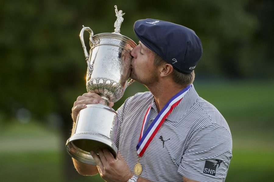 Bryson DeChambeau, of the United States, kisses the winners trophy after winning US Open Golf Championship, Sunday, Sept. 20, 2020, in Mamaroneck, N.Y.