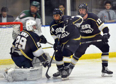 Brian Russell (far right) plays in a game for JCU Club Hockey.