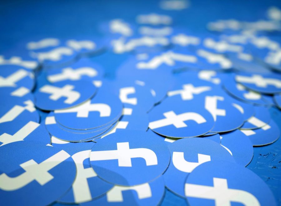 In this April 30, 2019, file photo, Facebook stickers are laid out on a table at F8, Facebooks developer conference in San Jose, Calif. (AP Photo/Tony Avelar, File)