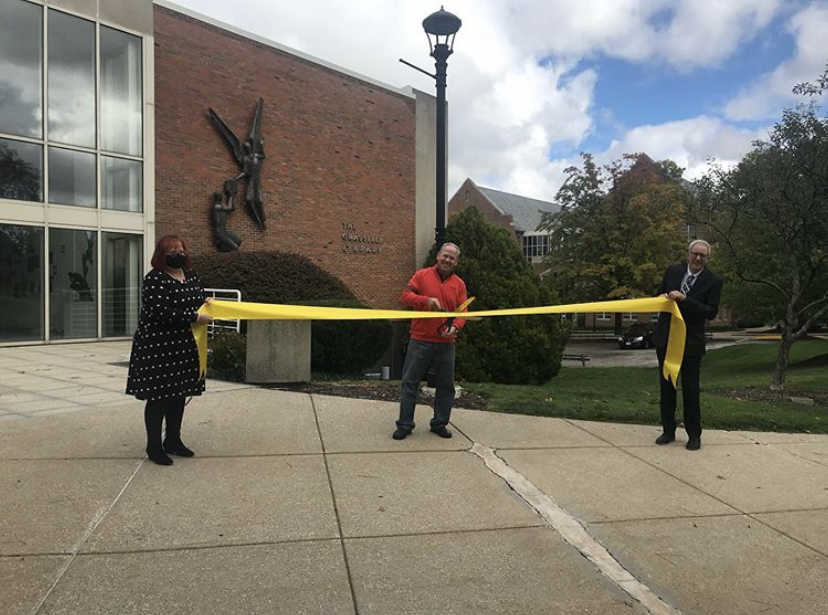(From left to right) Library Director Michelle Millet, John Mastrantoni 80 and President Michael Johnson officially launch phase one of renovations. (Photo from John Carroll University Instagram)