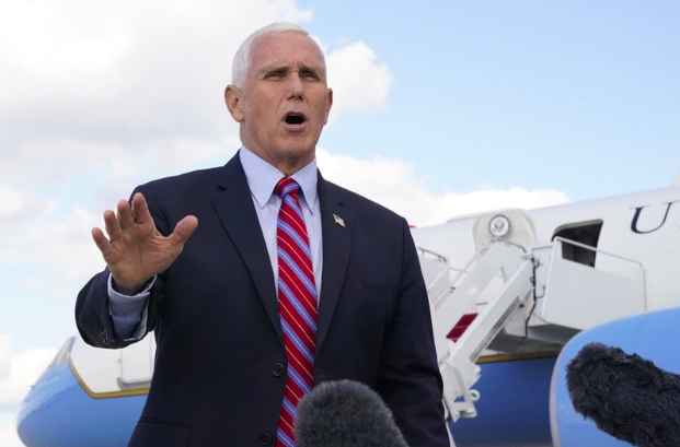 Vice President Mike Pence speaks to members of the media at Andrews Air Force Base, Md., Monday, Oct. 5, 2020, as he leaves Washington for Utah ahead of the vice presidential debate schedule for Oct. 7. (AP Photo/Jacquelyn Martin)