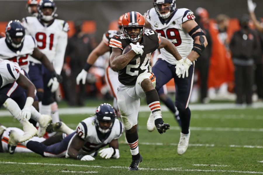 Cleveland Browns running back Nick Chubb (24) rushes for a 9-yard touchdown during the second half of an NFL football game against the Houston Texans, Sunday, Nov. 15, 2020, in Cleveland.(AP Photo/Ron Schwane)