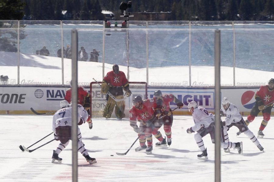Vegas Golden Knights right wing Alex Tuch (89) races for the puck against the Colorado Avalanche during the first period of of Outdoor Lake Tahoe NHL hockey game at Stateline, Nev., Saturday, Feb. 20, 2021. (AP Photo/Rich Pedroncelli)