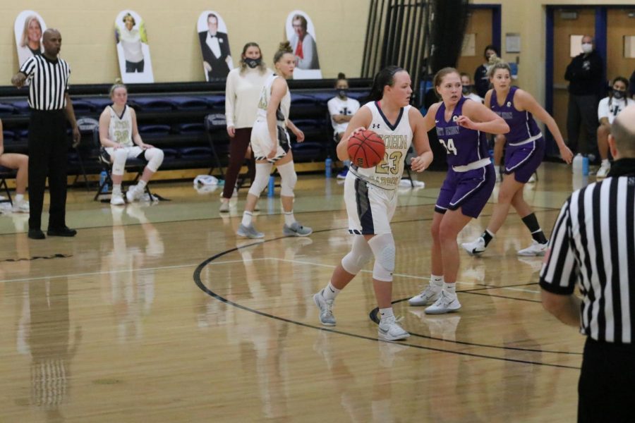 Nicole Heffington (ball in hand) is guarded by a Mount Union defender at the Tony DeCarlo Center on Jan. 29, 2021.