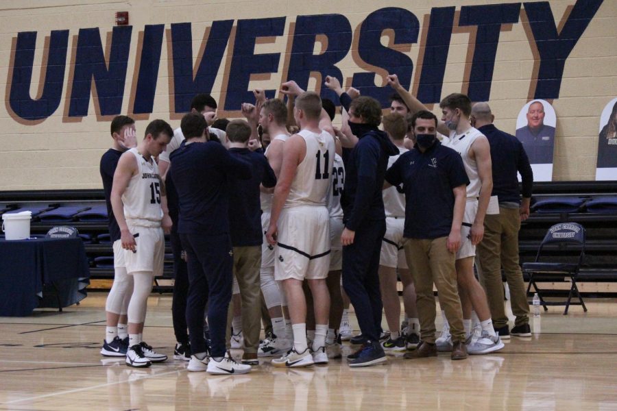 The John Carroll Men's Basketball team huddles at the Tony DeCarlo Varsity Center.