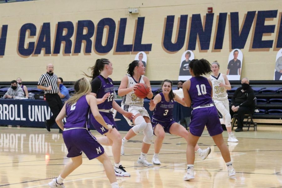 Nicole Heffington ball-in-hand) is surrounded by four Mount Union defenders in a game at the Tony DeCarlo Varsity Center on Jan. 29, 2021.