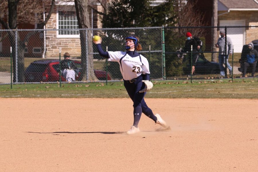 Lauren Sienkiewicz attempts to throw a runner out against Otterbein in a game on March 14, 2021, at Schweikert Field.