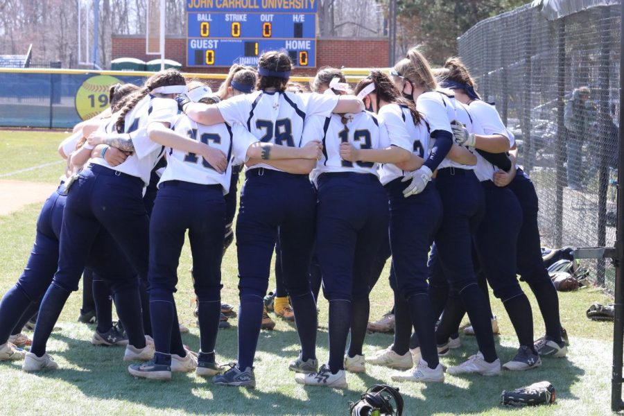 The John Carroll Softball Team huddles up before a double-header against Capital University at Bracken Field on Sunday, March 21.