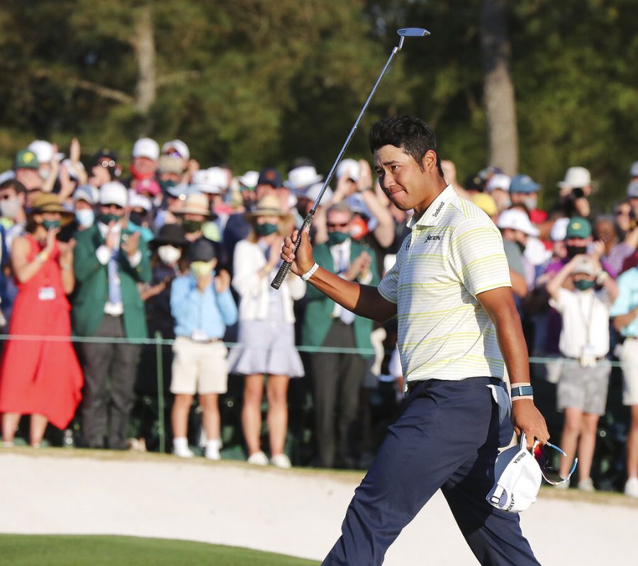 Hideki Matsuyama, of Japan, celebrates after winning the Masters golf tournament on Sunday, April 11, 2021, in Augusta, Ga. (Curtis Compton/Atlanta Journal-Constitution via AP)