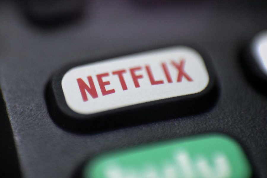 This Aug. 13, 2020 photo shows a logo for Netflix on a remote control.  