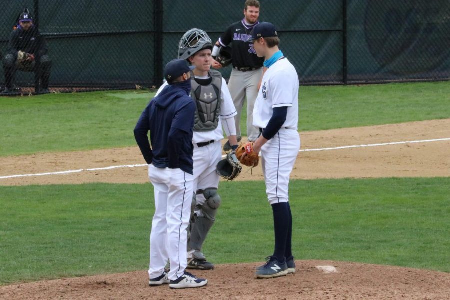 Bobby Bell (left), Collin Keene (middle) and Jon Ambro (right) during a mound visit in game two against Mount Union at Schweickert Field on Saturday, April 17.