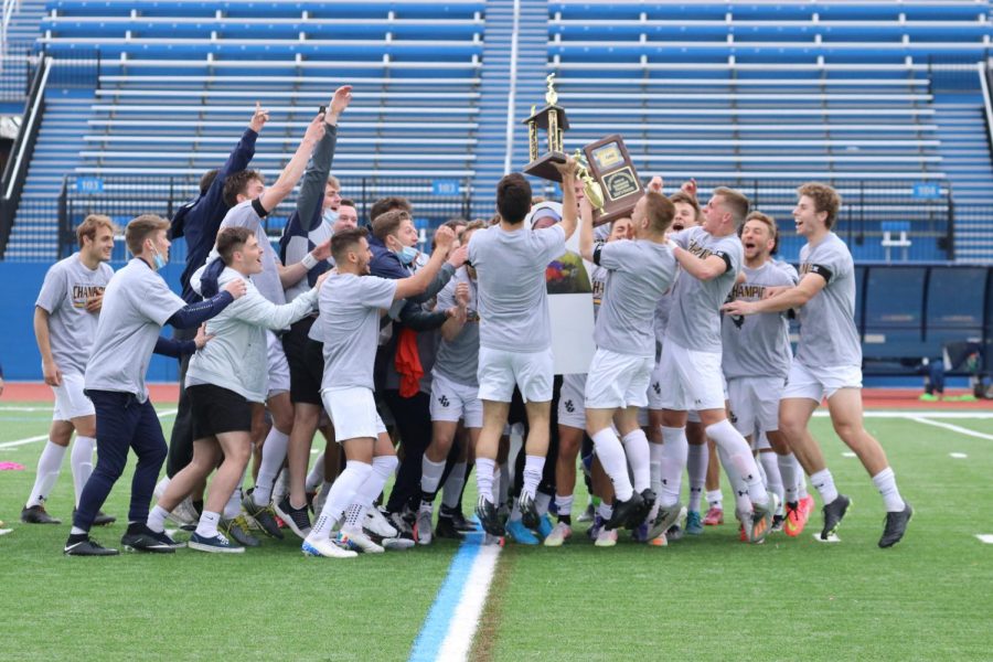 The John Carroll University Mens Soccer Team celebrates after winning the Ohio Athletic Conference Tournament championship against Marietta at Don Shula Stadium on Sunday, April 18, 2021.