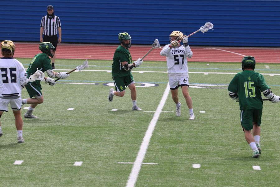 Skyler Blake looks to get a shot off against Wilmington at Don Shula Stadium on Saturday, April 10, 2021. 