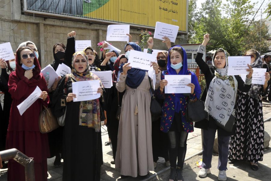 Women gather to demand their rights under the Taliban rule during a protest in Kabul, Afghanistan, Friday, Sept. 3, 2021. (AP Photo/Wali Sabawoon)