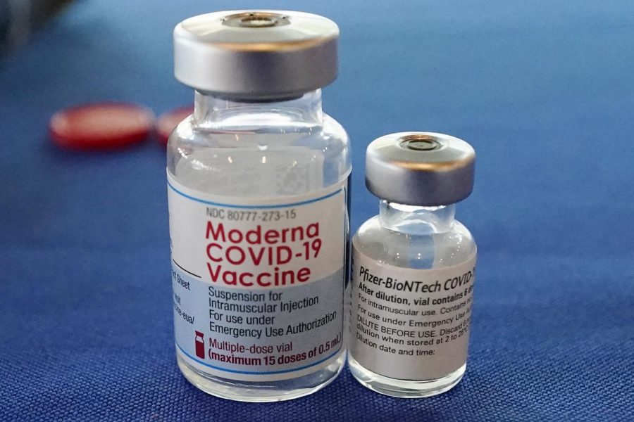 This Sept. 21, 2021 file photo shows vials of the Pfizer and Moderna COVID-19 vaccines in Jackson, Miss.  