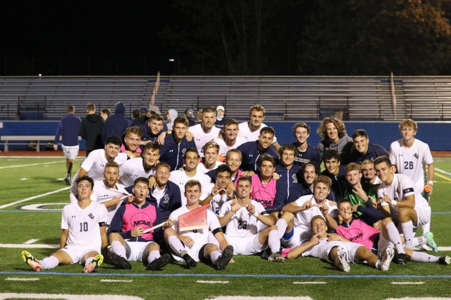 The John Carroll University Men's Soccer team celebrating after a 2-1 overtime victory against the College of Wooster. 