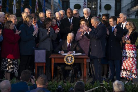 President Joe Biden signs the Infrastructure Investment and Jobs Act during an event on the South Lawn of the White House, Monday, Nov. 15, 2021, in Washington.