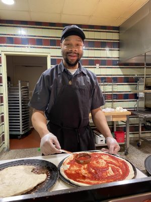 Lamarr Richardson, a cafeteria worker at JCU, spreads happiness through his work.
