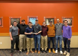 Delta Tau Delta President Greg Pal '22 stands with his brothers after winning the Court of Honor