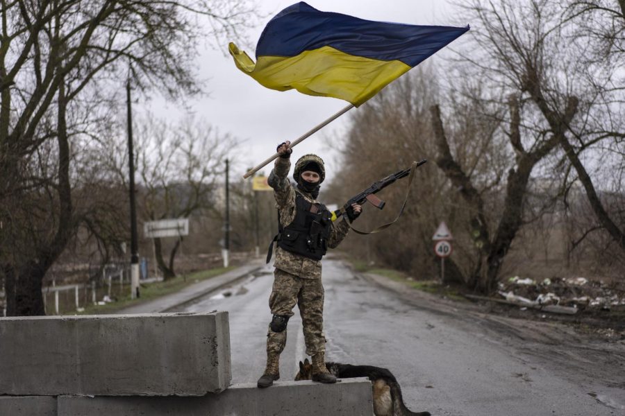 A Ukrainian soldier celebrates in a check point in Bucha, in the outskirts of Kyiv, Ukraine, Saturday, April 2, 2022.