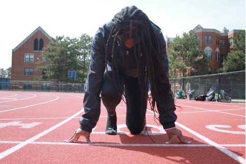 Campus editor, Taylor Anthony, at John Carroll’s track in Don Shula Stadium. 