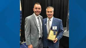Mike Scanlan and Chris Wenzler at the 2019 John Carroll Athletics Hall of Fame ceremony.  