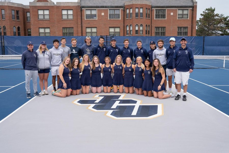 The John Carroll Mens and Womens Tennis team posing on the new court logo on Saturday, April 30. 