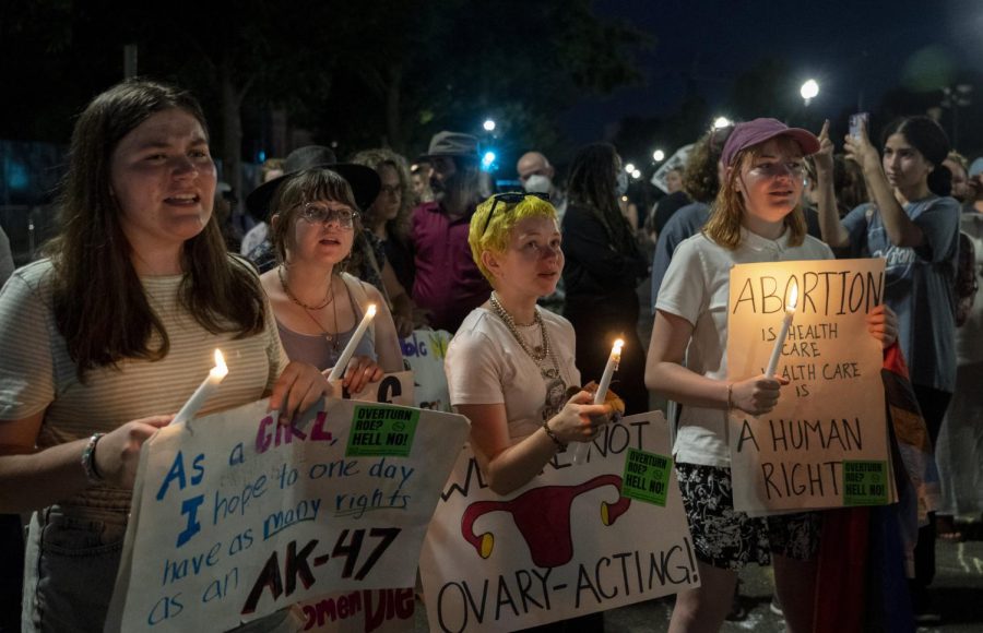 Abortion-rights protesters participate in a candlelight vigil for reproductive freedom and abortion rights outside the Supreme Court in Washington, Sunday, June 26, 2022.