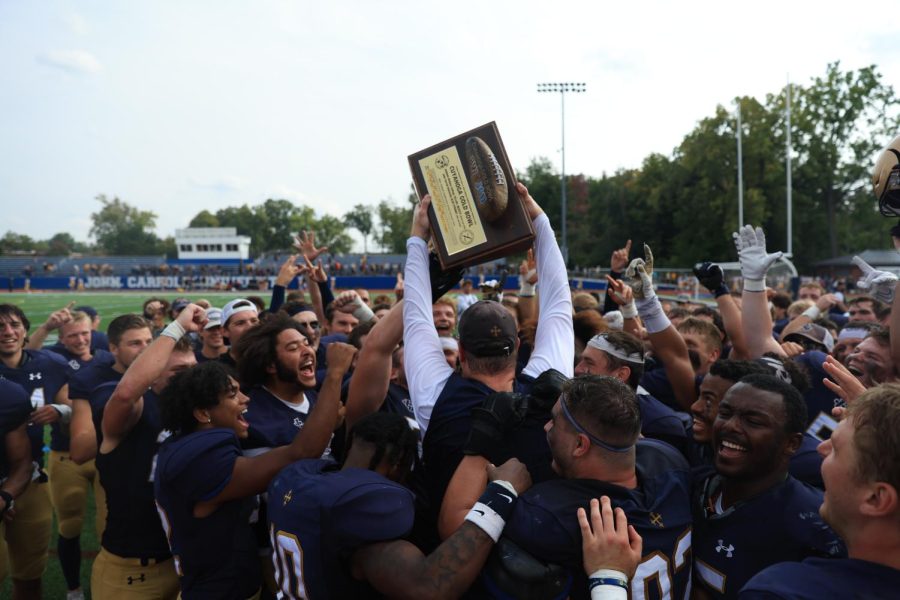 The JCU Football Team celebrates winning against BW and keeping the rock in University Heights. 