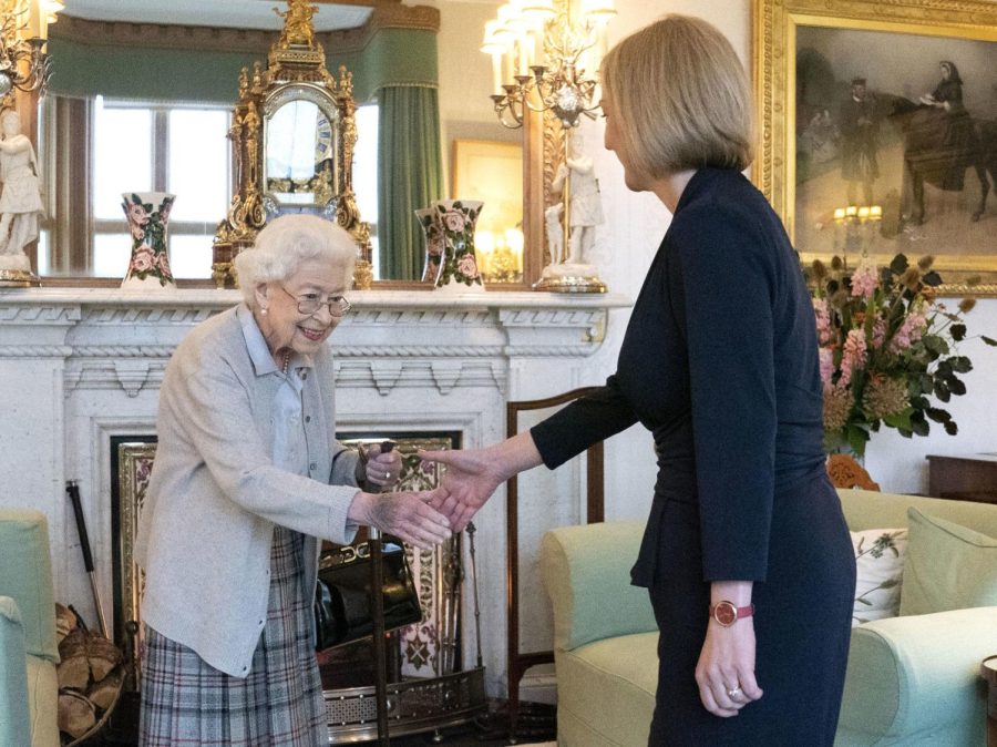 Britains Queen Elizabeth II, left, welcomes Liz Truss during an audience at Balmoral, Scotland, where she invited the newly elected leader of the Conservative party to become Prime Minister and form a new government, Tuesday, Sept. 6, 2022.