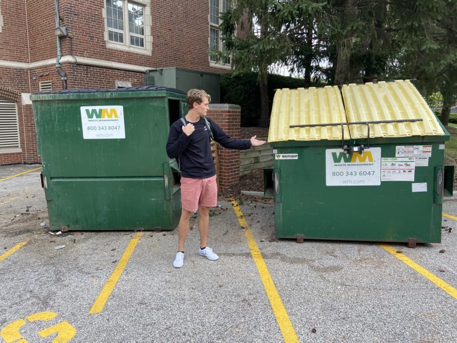 Eric Fogle, Unlicensed Tour Guide, practices gesturing to one of JCU's finest dumpsters.