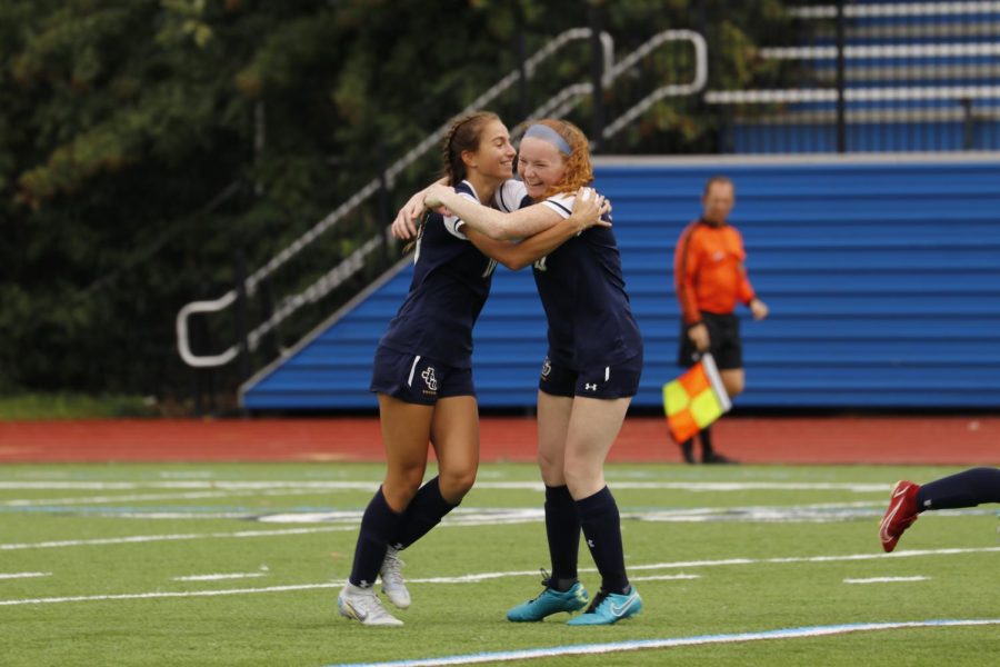 Emily Patryzk embraces her teammate following her goal in the Senior Day game on Sunday.