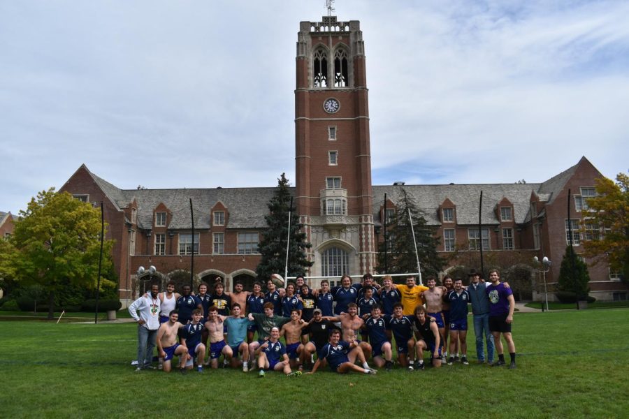 The Club Rugby Team in front of the clocktower after competing in one of their games.