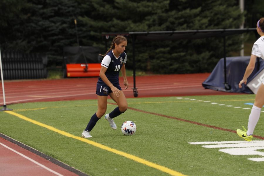 Emily Patryzk dribbles up the sideline for the Blue and Gold.