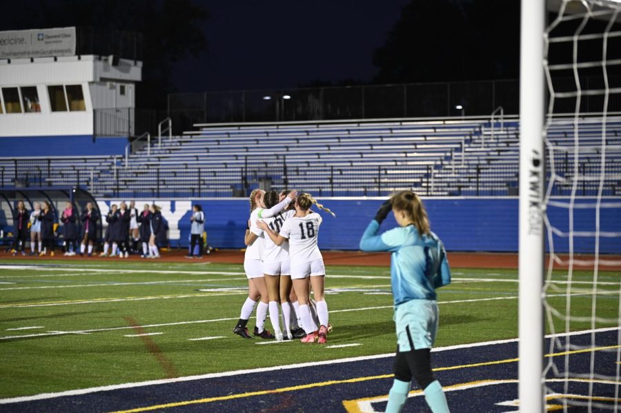 The team celebrates after a great score against Marietta on Saturday.