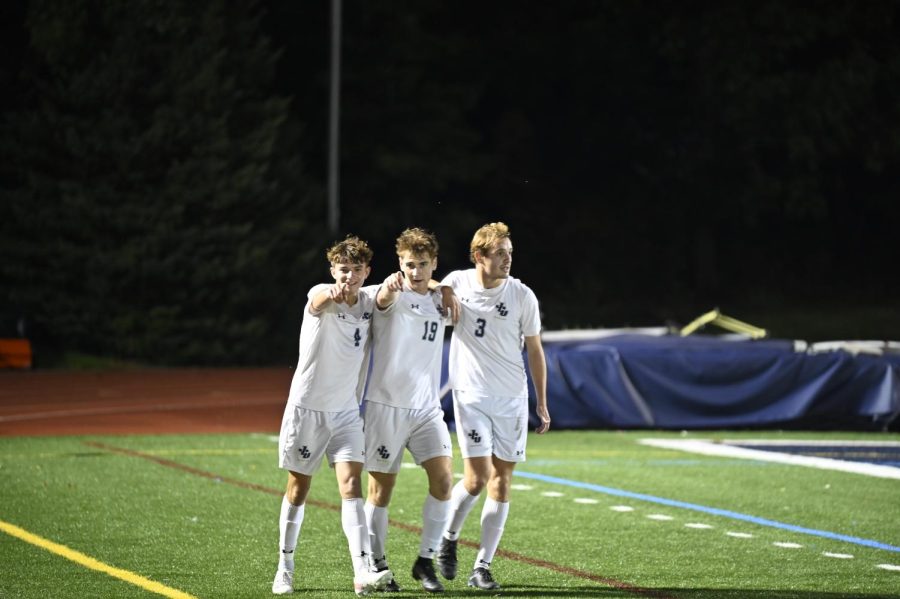 The Mens Soccer team celebrates their win on Saturday night.
