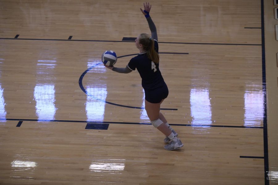 Lexi MacDonald on the serve for JCU. 