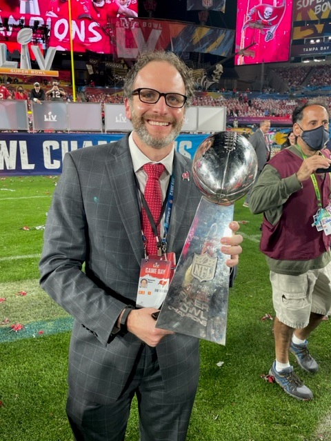 Ben Milsom with the Vince Lombardi Trophy after the Bucs won the Super Bowl in 2021.